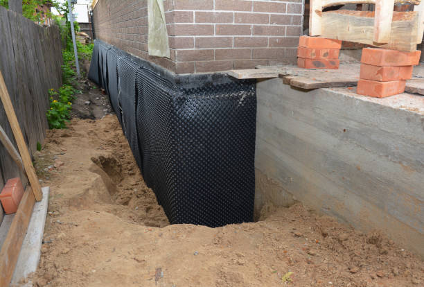 Happy homeowners after waterproofing job in Parkville